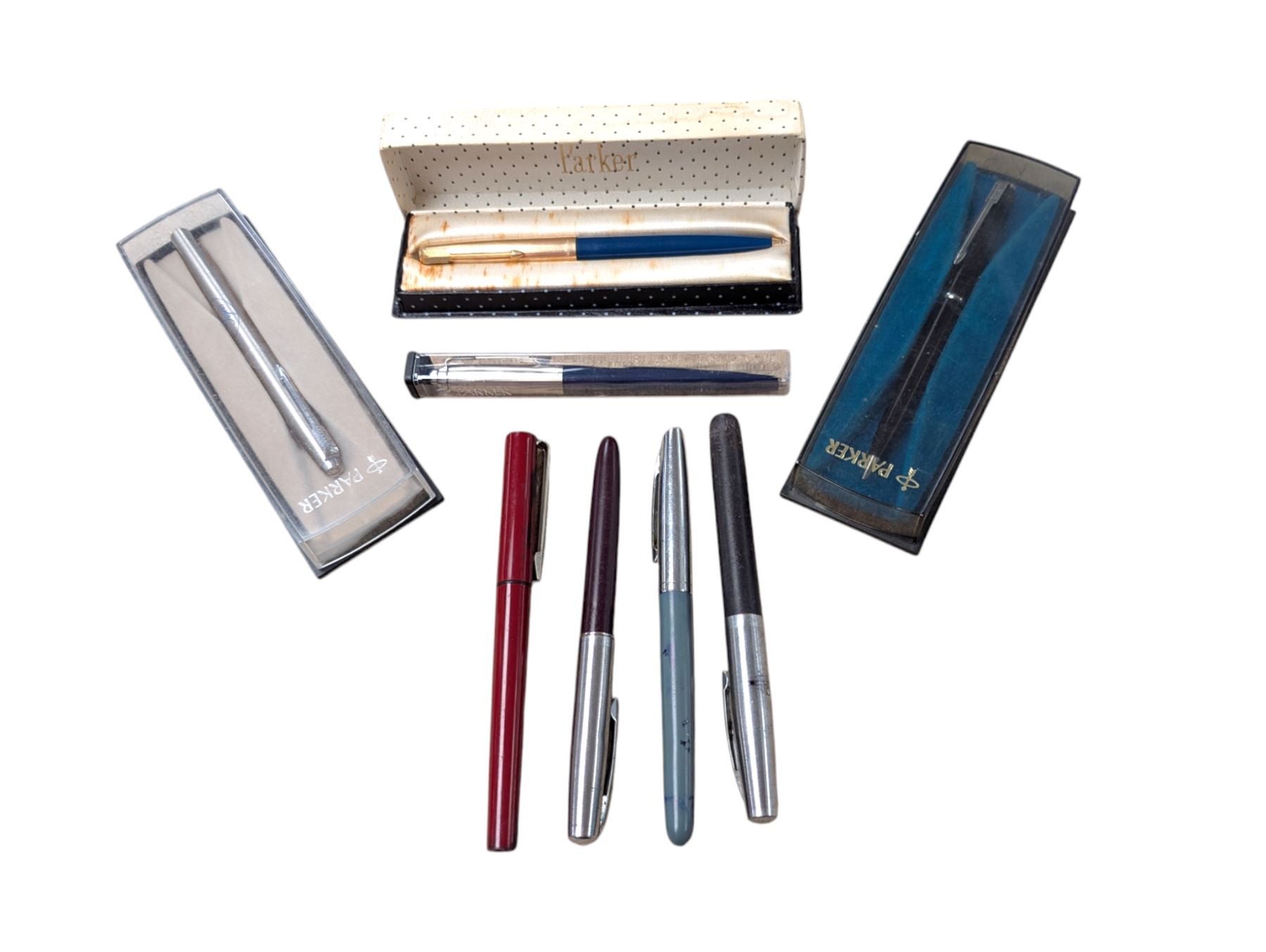 Four cased Parker pens and four other pens