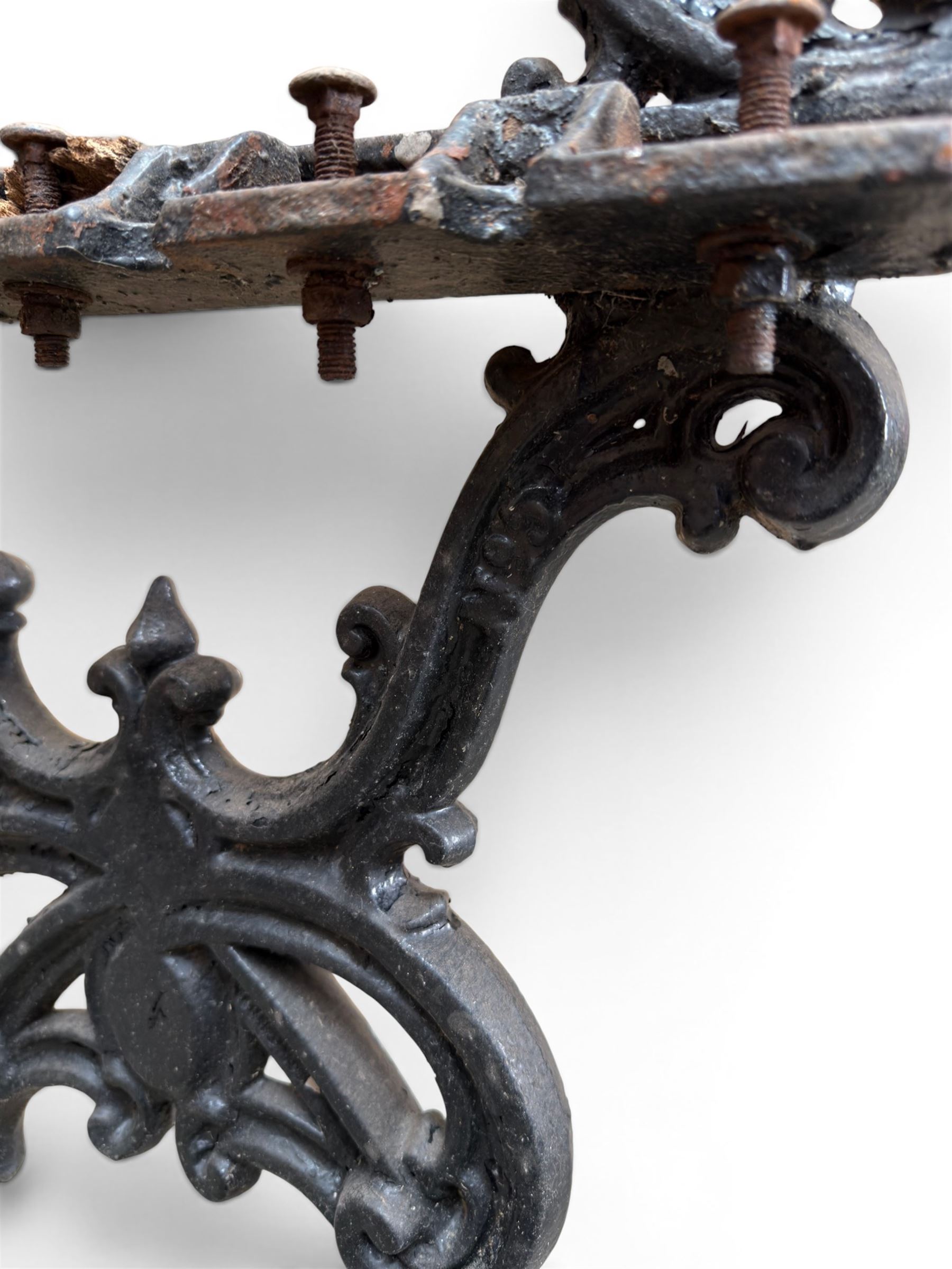 Carron Foundry - two pairs of 19th century cast iron garden bench ends, ornate detail with arms and X shaped legs,finish in black paint, the design no. 110396, first registered 13 July 1857 (see illustration), width as desired