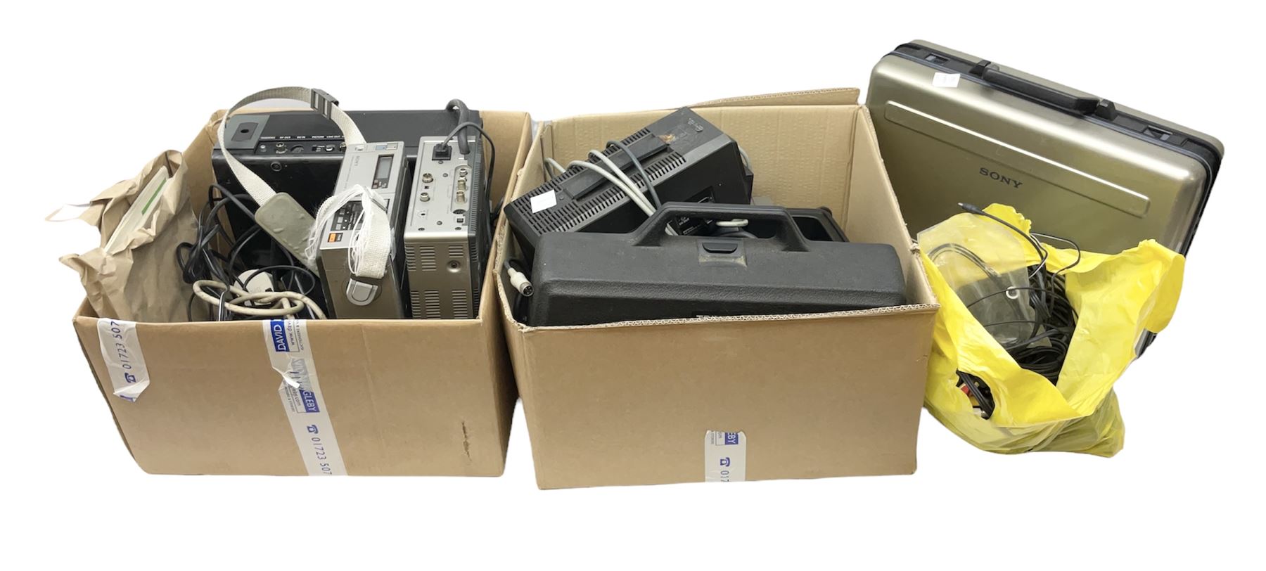 Cased Sony 'Trinicon' HVC-200P video camera, Sony Betamax portable video cassette recorder, cased Sony Video 8 CCD-V100E video camera, Sony SL-F1UB portable video cassette recorder, two Sony AC power adaptors etc