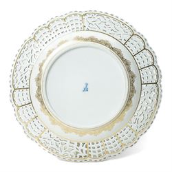 19th century Meissen cabinet plate, the reticulated border modelled with trellis panels and forget-me-nots,  the cobalt blue well with gilt bordered central reserve painted with a scene of a hunting party after Philips Wouwerman (Dutch 1619-1668), underglaze blue crossed swords and indistinct impressed numbers verso, D26cm