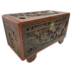 Mid-20th century Singapore camphor wood blanket chest, heavily carved depicting battle scenes and cityscapes 