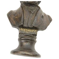 Three small bronze effect brass busts, modelled as composers Beethoven, Bach, and Wagner, each titled and raised upon a socle base, H14.5cm