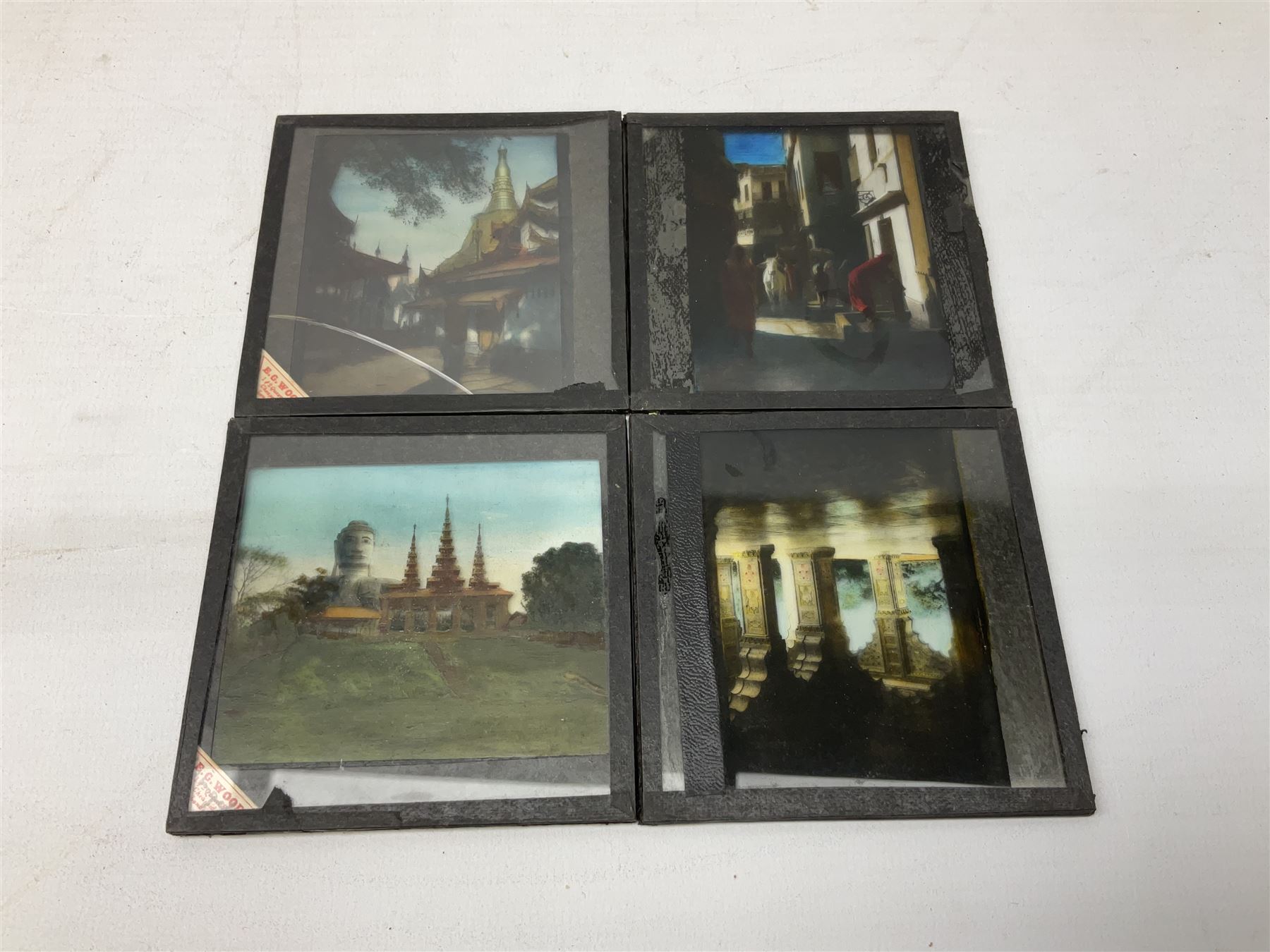 Large collection of over three hundred glass magic lantern slides including country, beach, town and street scenes, some with figures and animals