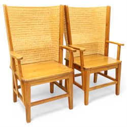 Pair of 20th century full-size pine Orkney chairs, high-back armchairs of traditional design, pegged and wedged construction, wrap-around backrest and sides, above scrolled out-swept arms and solid rounded pine seat, raised on square tapering legs united by stretchers, hand-signed ‘Jackie Miller’ and stamped ‘Orkney’
