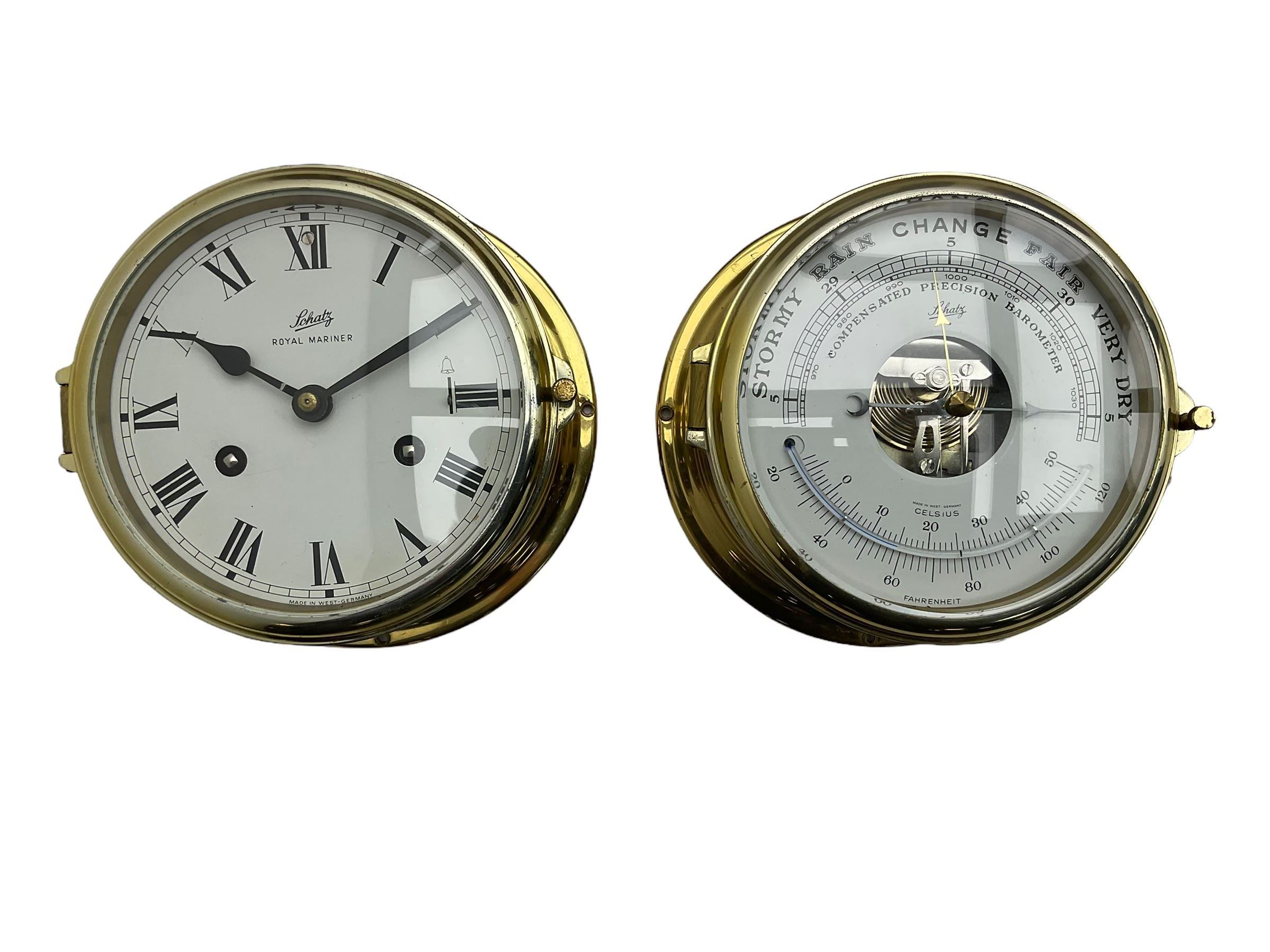Eight-day 20th century brass cased “Schatz Royal Mariner” bulkhead clock, with a 6” dial, Roman numerals and minute track, bells on/off control, black spade hands with a brass bezel and flat bevelled glass, twin train spring driven balance wheel movement sounding the ships watches on a bell.
With a corresponding and matching Schatz open dial compensated aneroid barometer, with weather predictions and measuring barometric pressure in inches and millibars, with a curved spirit thermometer measuring temperature in Fahrenheit and Celsius, steel indicating hand and brass recording hand.
