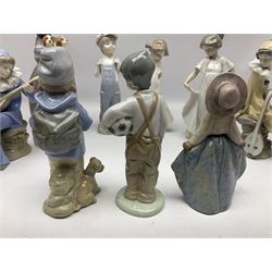 Fourteen Nao figures, to include First Love, Girl with puppies, geese, etc, together with a Lladro goose