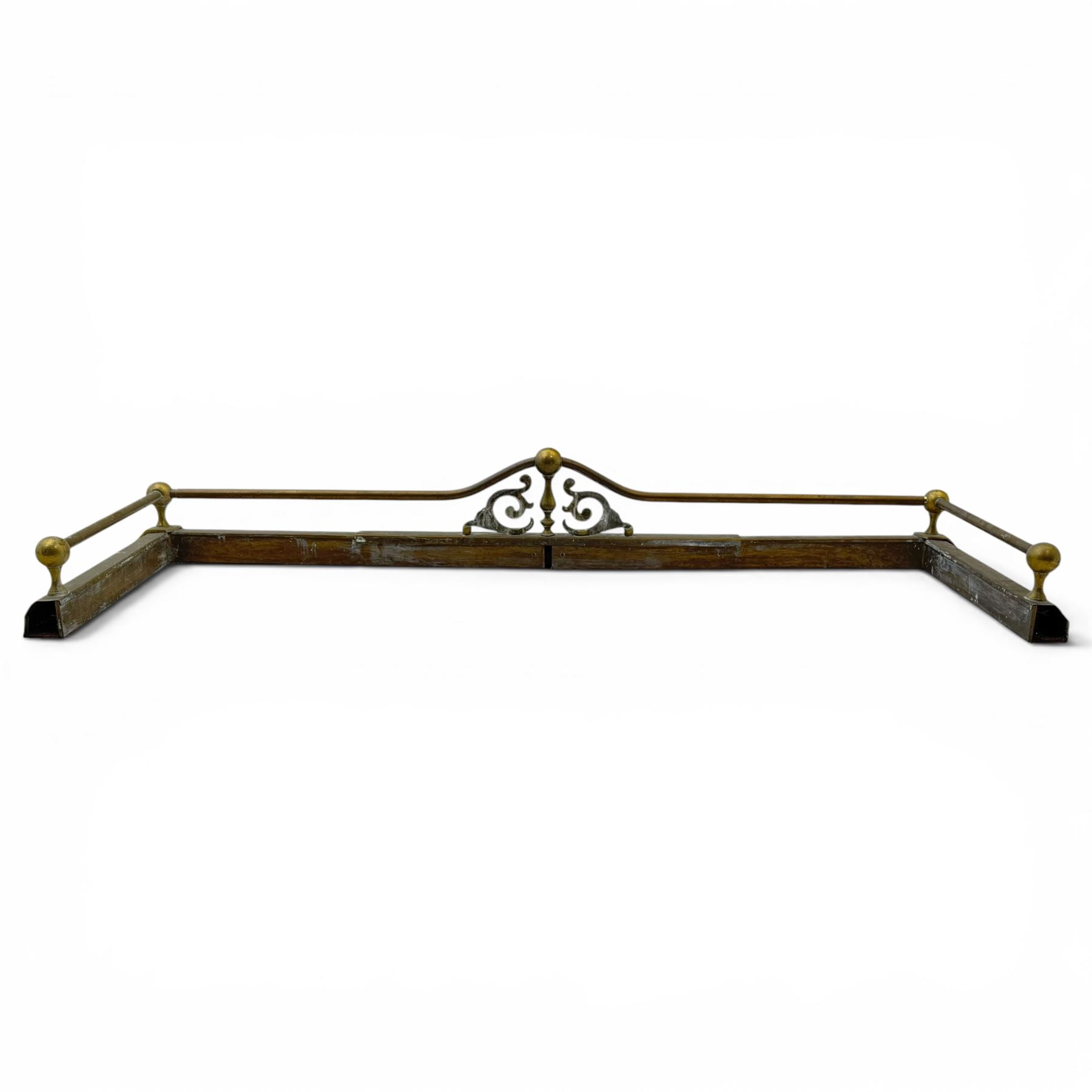 Three 20th century brass fenders, two with pierced Art & Crafts design rails, largest W156cm, D 45cm 