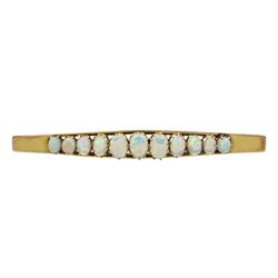 Early 20th century gold graduating eleven stone opal brooch, stamped 9ct