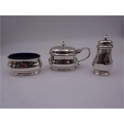 Group of silver, to include a 1930's three piece cruet set, comprising mustard pot and cover with blue glass liner, open salt with blue glass liner and pepper, hallmarked William Comyns & Sons Ltd, London 1933 and 1937, an early 20th century mustard pot and cover of hexagonal bellied form, with blue glass liner, hallmarked Birmingham 1918, makers mark worn and indistinct, 1920's silver mounted pepper, of bellied form with weighted foot, and a group of assorted flatware, including a Victorian fiddle pattern table fork, pair of George III salt spoons, etc., approximate total weighable silver 13.01 ozt (404.8 grams)