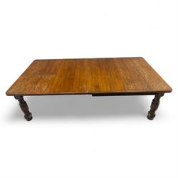 Victorian oak extending dining table, rectangular moulded top with figured grain pattern and wind-out action operated by removable crank handle, complete with additional leaves, raised on four boldly turned and reeded baluster supports terminating in squat bun feet (Extends to 238cm)