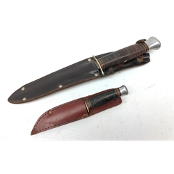  WW2 Fighting knife, 15cm twin edge tapering steel blade stamped William Rodgers I Cut My Way, Made in Sheffield England, nickel oval crossguard with leather grip, 27.5cm in leather sheath and a William Rodgers skinning knife, L15cm, leather sheath stamped Sheffield England, (2)  