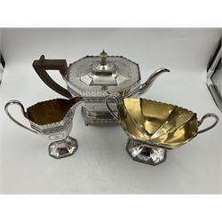 Victorian silver four piece tea service, comprising teapot, teapot stand, twin handled open sucrier and milk jug, each of octagonal form with foliate bud border and engraved decoration including crest to canted panels, and vacant panels, the teapot with ivory finial to the hinged cover and later wooden handle, hallmarked Edward Barnard & Sons Ltd, London1896, teapot including finial H15cm, milk jug including handle H16cm, teapot stand W11.5cm

This item has been registered for sale under Section 10 of the APHA Ivory Act