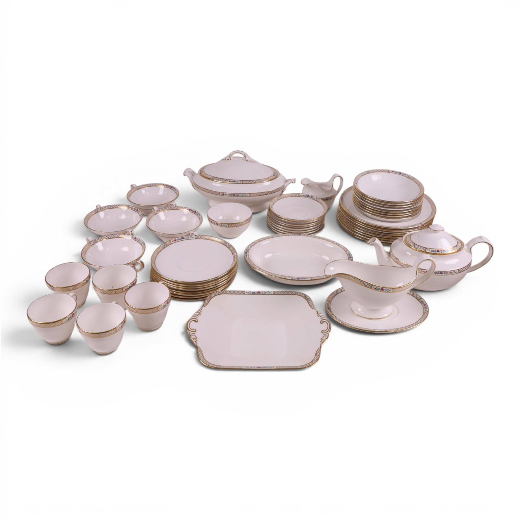 Spode Golden Trellis tea and dinner service for eight, including teapot, milk jug, open sucrier, teacups and saucers, dinner plates, soup bowls, side plates etc 