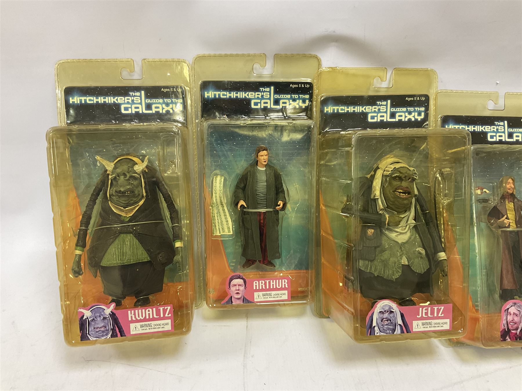 Sixteen carded action figures comprising seven 'Gears of War'; four 'Hitchhikers Guide to the Galaxy'; two 'Torchwood'; 'Planet of the Apes'; 'Bruce Lee'; and 'Assassin's Creed'; all in unopened packs (16)
