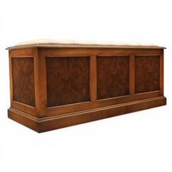 Traditional design figured elm blanket chest, with padded striped upholstered seat, over a...