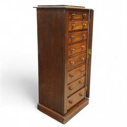 Victorian mahogany Wellington chest, the rectangular top above eight graduated drawers each fitted with turned knobs, flanked by hinged locking stiles, raised on a plinth base