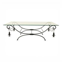In the manner of Maison Jansen - Regency inspired glass and wrought metal coffee table with scrolling X-form base