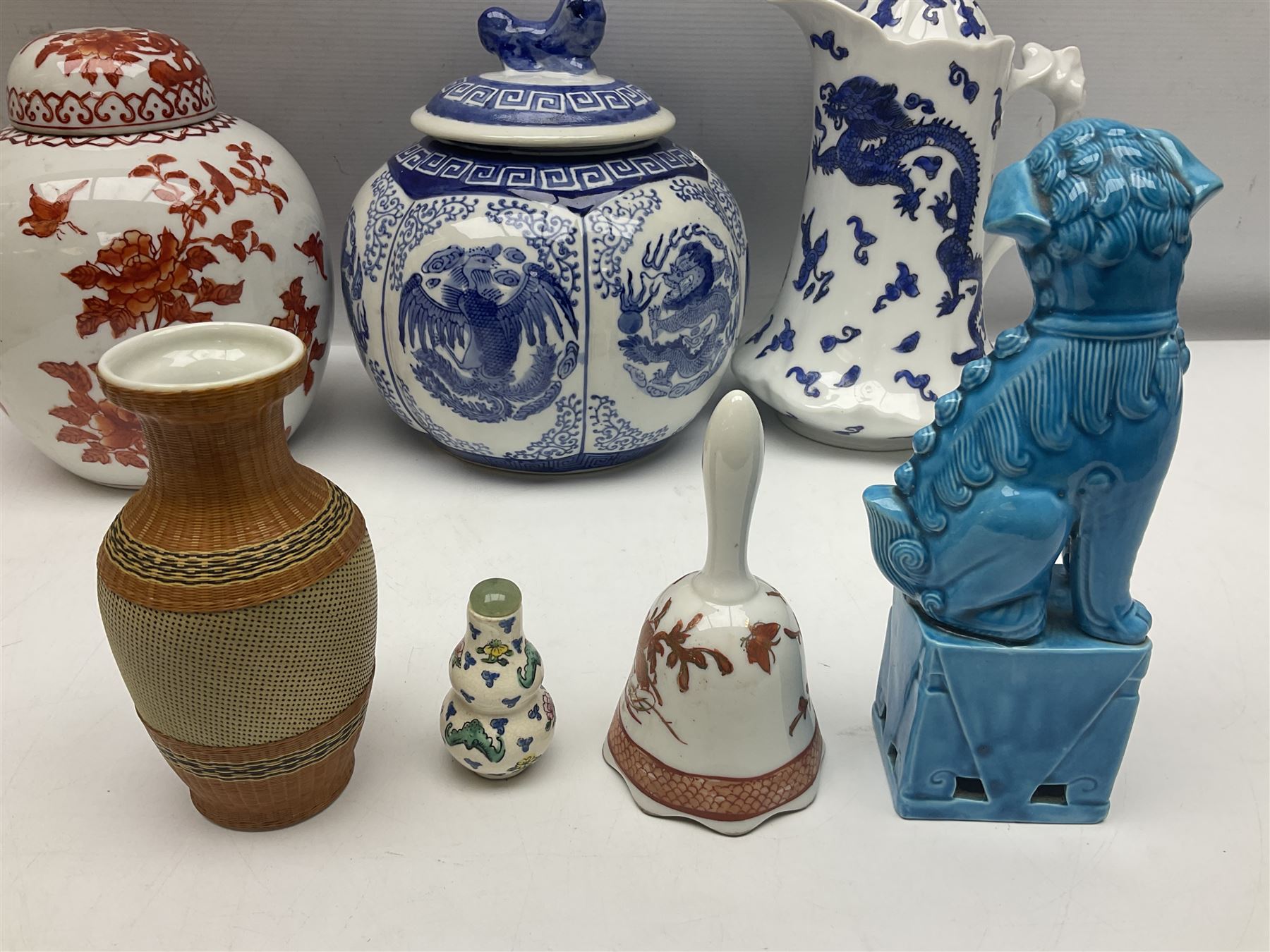 Chinese turquoise glazed foo dog, together with Yang Cheng iron red ginger jar, snuff bottle, and other oriental ceramics 