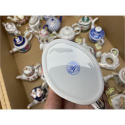 Twenty seven Porcelain Art miniature teapots, with wooden display together with a collection of other ceramics and glassware etc, including Goebel Hummel collectors plates, in three boxes,