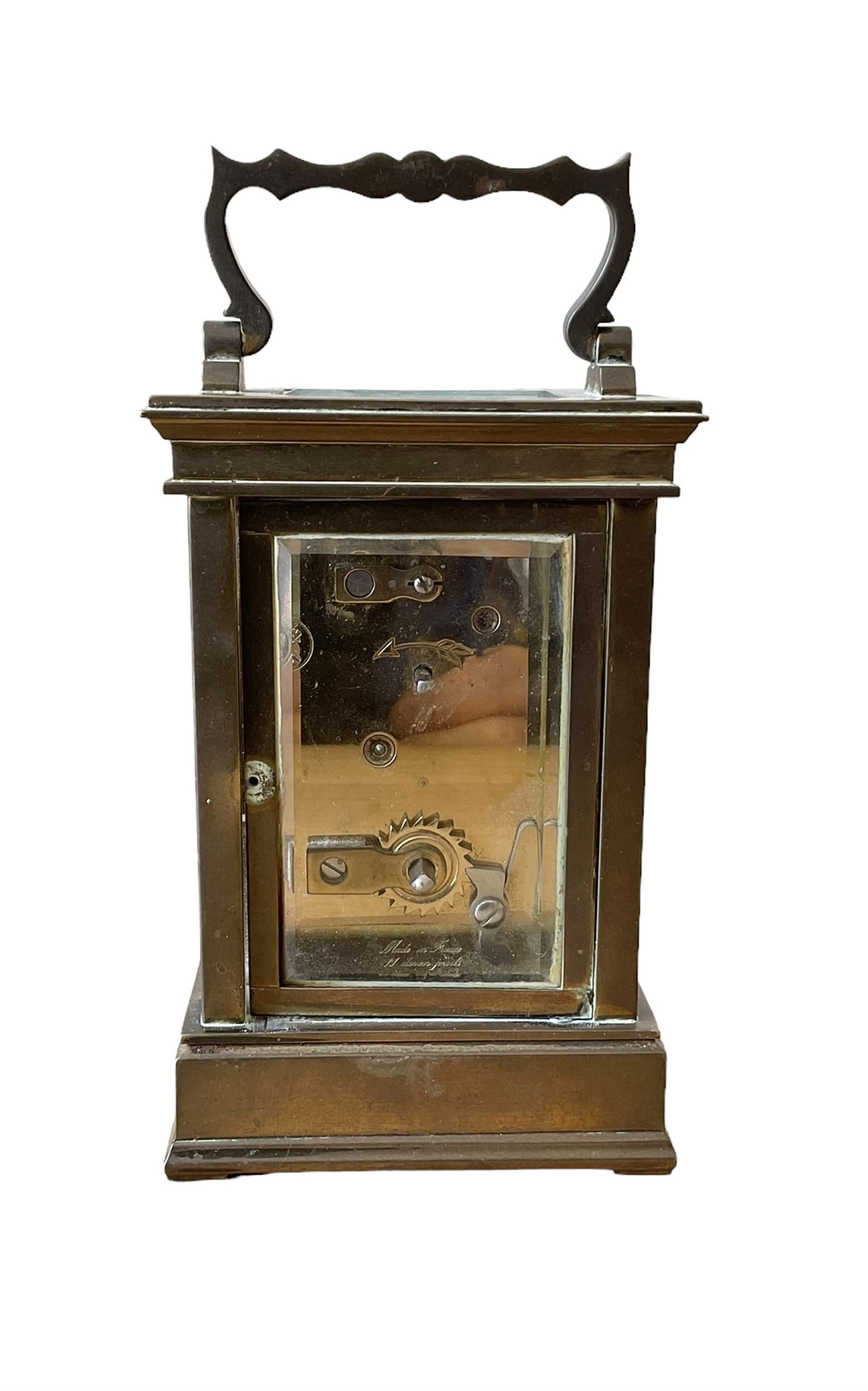 French -  brass cased 20th century  8-day timepiece carriage clock, dial inscribed L' Epee Fondee-En 1839, Sainte Suxanne, France, with a circular enamel dial and an embossed brass dial mask, Roman numerals, minute markers, five minute Arabic's and steel moon hands, with a jewelled lever platform escapement.