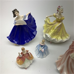  A group of Royal Doulton figurines, comprising Sara HN2265, Southern Belle HN2425, Summer Serenade HN3610, Ruth HN4099, Elaine HN2791, Figure of the year 2000 Rachel HN3976, and Ninette HN2379 (a/f), plus two smaller Royal Doulton figurines, Victoria HN3909, and Christine HN3269 (a/f).  