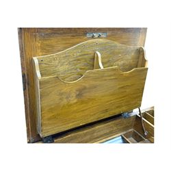 Edwardian oak metamorphic 'Britisher Writing Table', rectangular hinged top revealing correspondence compartments and hinged writing surface with underside storage, flanked by twin hinged compartments with dividers, on turned supports