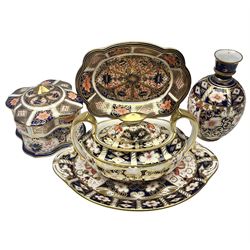 Collection of Royal Crown Derby Imari pattern, comprising covered trinket box, twin handled sucrier and saucer, oval dish and vase, all with printed marks beneath  