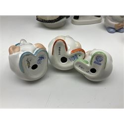 Group of eleven Aquincum of Budapest figures, comprising two of a man in a feather hat, seven dwarves, man and woman in traditional dress, all with printed marks beneath