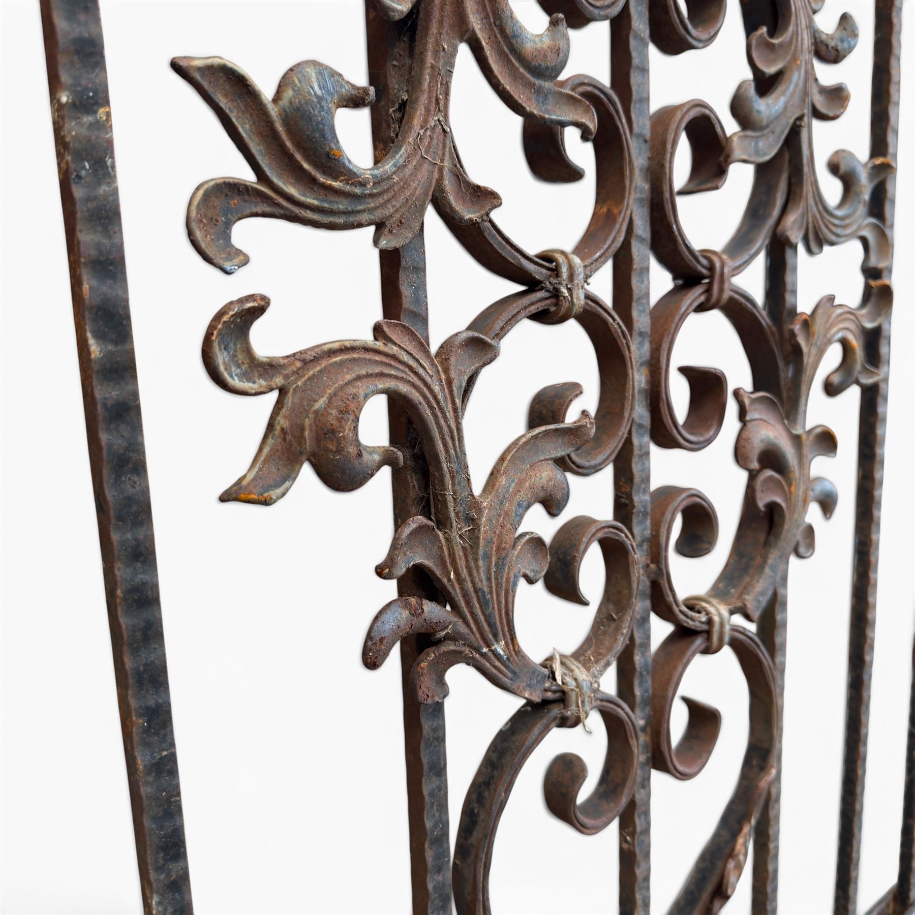 Victorian wrought iron vineyard gate, with ornate scrollwork and foliate acanthus leaf decoration, shaped cresting and central decorative panel, finished in rustic black painted finish