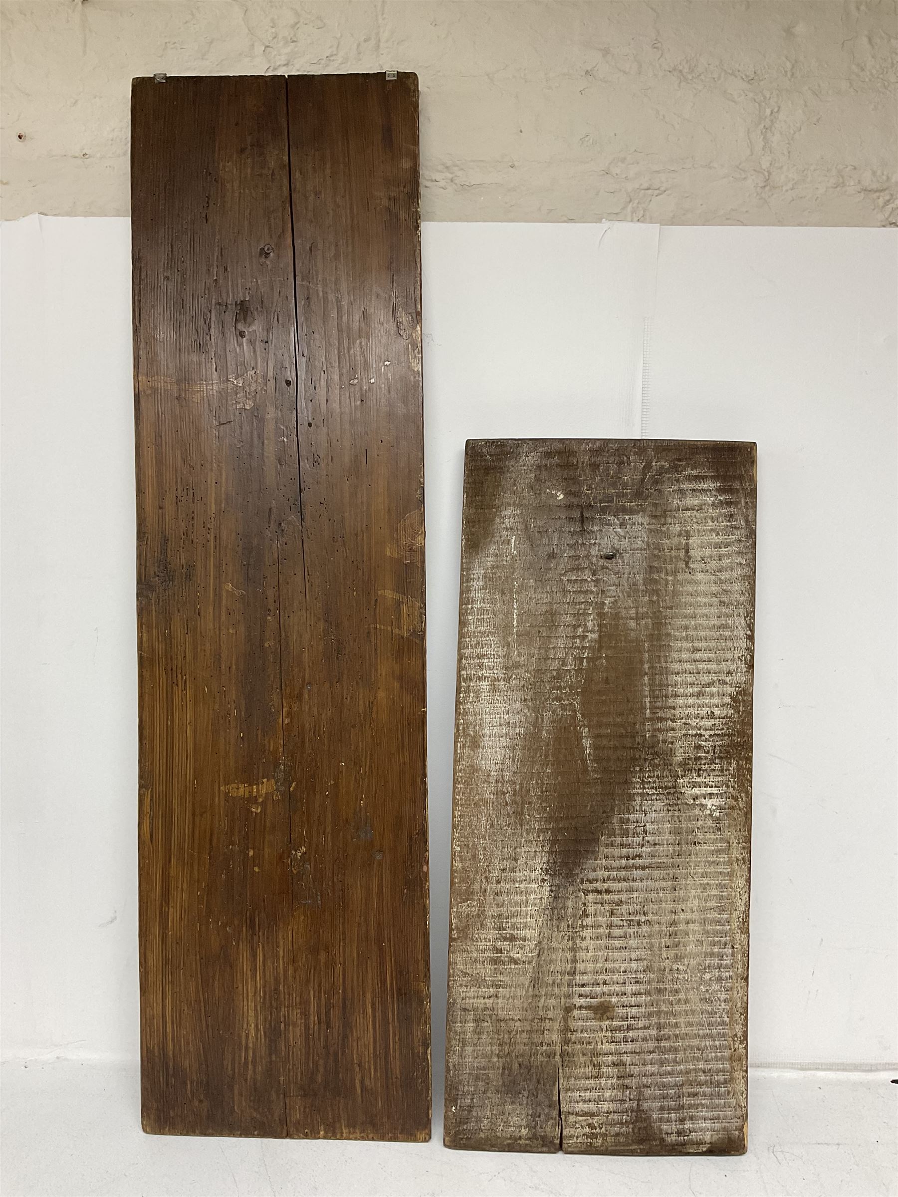 Two 20th century hardwood Dutch folk art Speculaasplank or biscuit moulds, typically carved with figures in traditional dress, largest H101cm