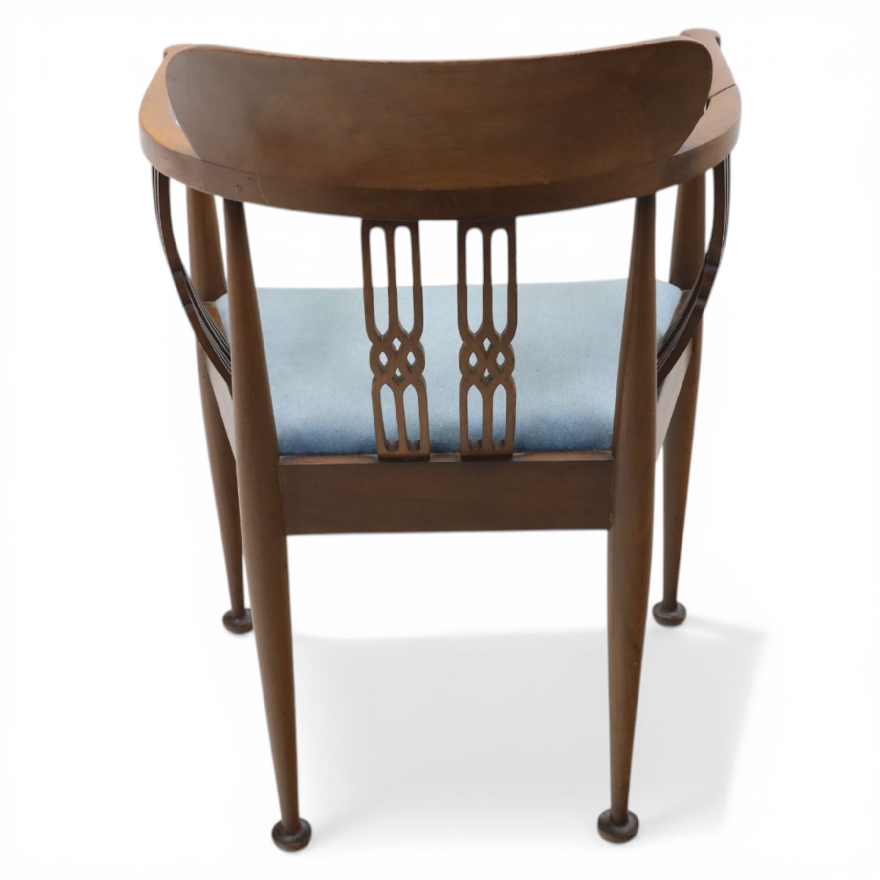 Early 20th century Hepplewhite style mahogany armchair, upholstered shaped back over pierced splat back with linked oval decoration, open arms and upholstered seat, on square tapering supports terminating in pad feet