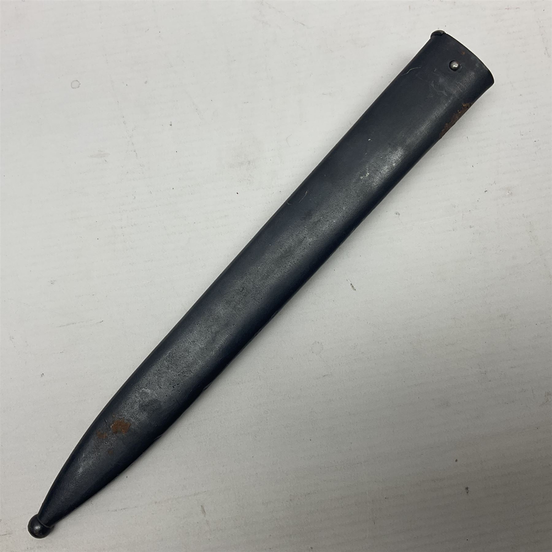 Austrian Model 1895 Carbine knife bayonet with 24.5cm fullered steel blade; various marks to the ricasso including F.G. GY.; cross-piece marked No.7843; in steel scabbard L37cm overall