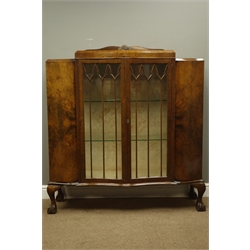  1930's figured walnut serpentine front display cabinet  on ball and claw feet, W120cm  