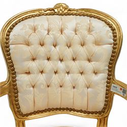 French design gold painted framed armchair, serpentine front with cream damask upholstery, padded arms with studded border  