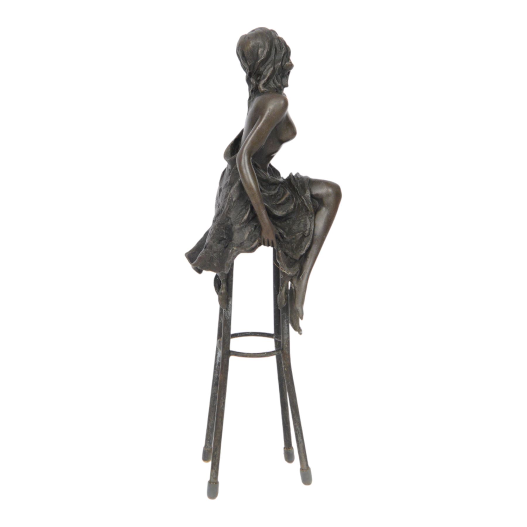 Art Deco style bronze modelled as a semi naked female figure, seated upon a chair, after 'Pierre Collinet', H27cm