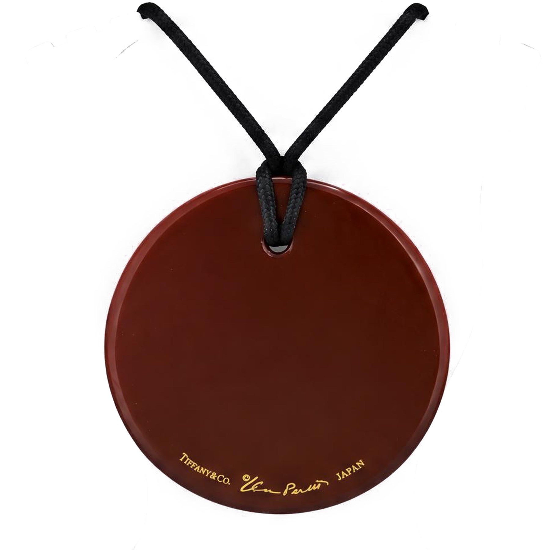 Tiffany & Co. red lacquer on Japanese hardwood round pendant necklace, on black silk cord by Elsa Peretti, signed 