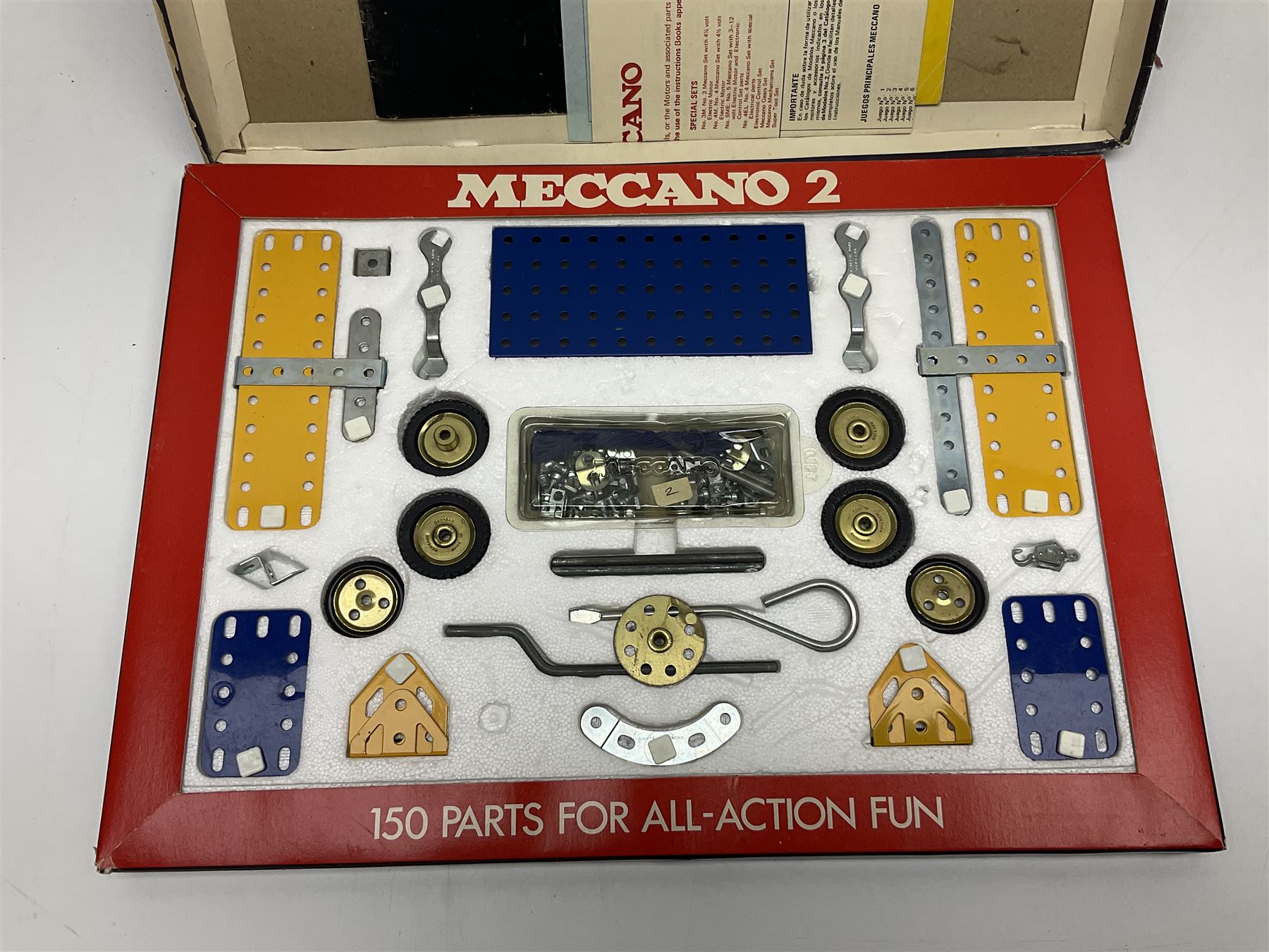 Meccano - Outfits 2, 3 & 4 with blue and yellow parts; look to be virtually complete with most apertures filled; together with a partially stocked Meccano Elekrikit; all boxed with instruction manuals (4)