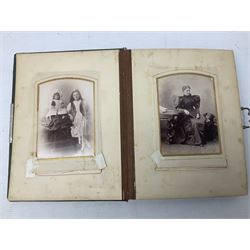 Victorian desk ink blotter, decorated with painted spray of flowers within stylised gilt rococo spandrels with mother of pearl fixings, together with a Victorian photo album containing interior leaves with apertures of various sizes and shapes of portraits surrounded by printed sea and dock scenes, blotter L28cm