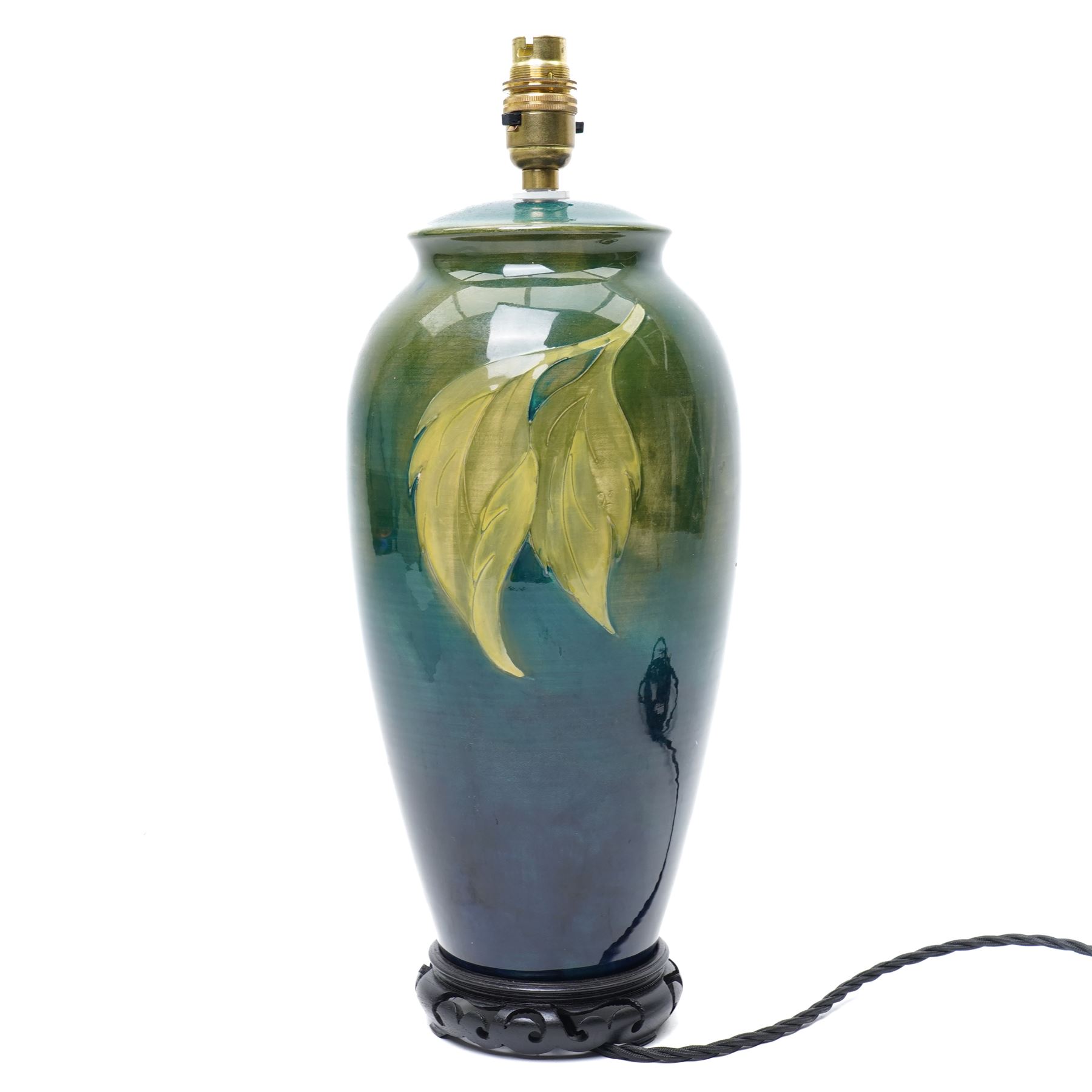 Moorcroft 'Hibiscus' pattern table lamp on green ground, including stand and fittings H42cm