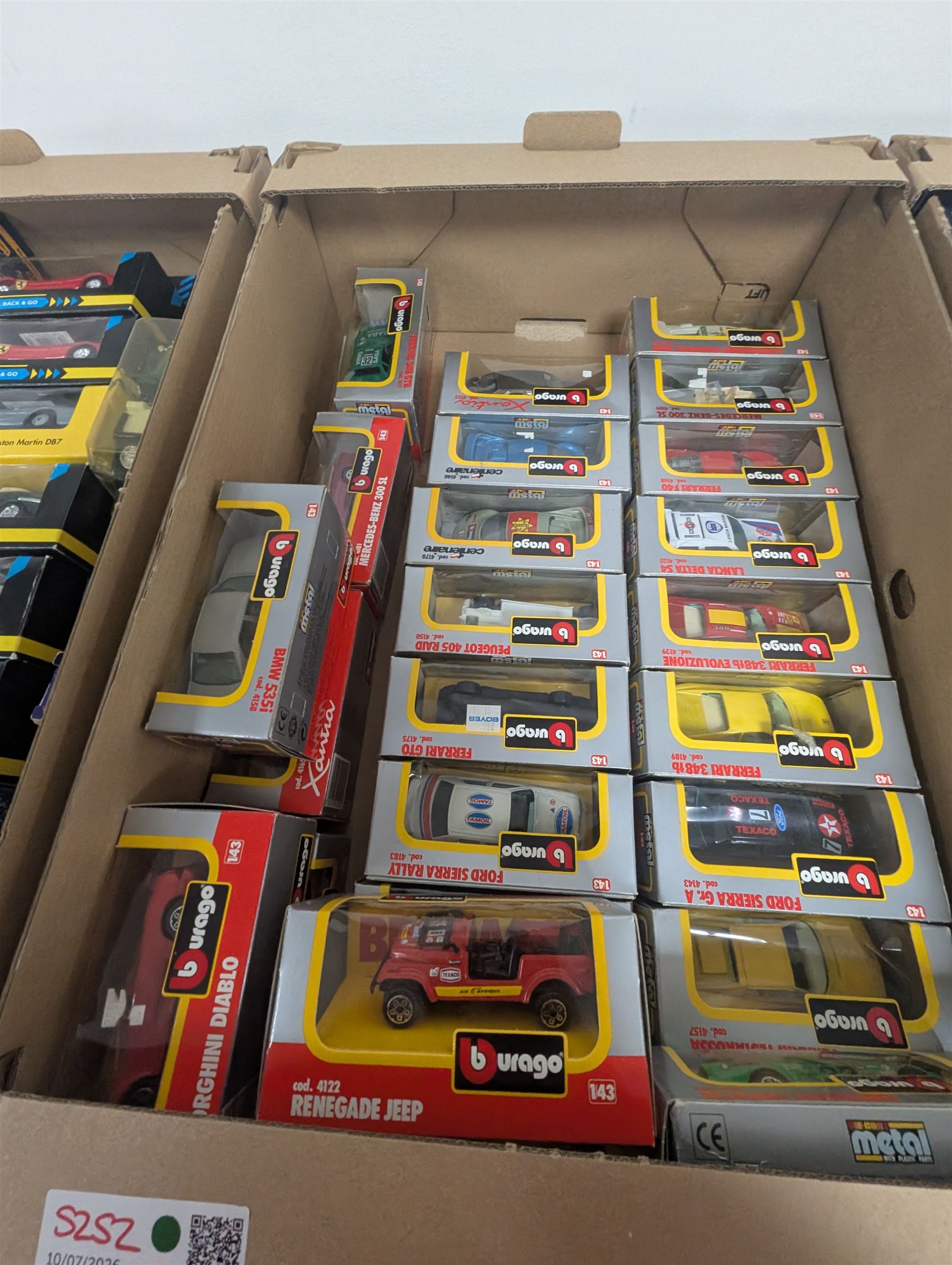 Collection of 1:43 scale diecast model vehicles, mostly Bburago, all boxed, in three boxes