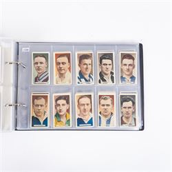 Collection of Edwardian and later Football related trading and cigarette cards, including forty-nine of fifty 1906 Ogden's Football Club Colours, 1922 PALS Footall series, ninety of one hundred 1925 Gallaher Famous Footballers, complete set of forty-four 1926 Ogden's Captains of Association Football Clubs and Colours, complete set of fifty 1927 Players Football Caricatures by MAC,  complete set of fifty 1927 Players Football Caricatures by RIP,  complete set of fifty 1930 Players Association Cup Winners, complete set of 50 1933 Ogdens AFC Nicknames etc, housed in brown cigarette card album
