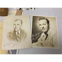 Approximately sixty portraits of mid-20th century film stars and entertainers, some bearing original or printed signatures - various pin-ups including Marilyn Monroe, Gina Lollobrigida, Joan Collins, Sabrina, Elizabeth Taylor etc, Tony Curtis, Dana Andrews, Marlon Brando, Alan Ladd etc; and a small four-drawer filing chest containing a quantity of film cells made into photographic slides