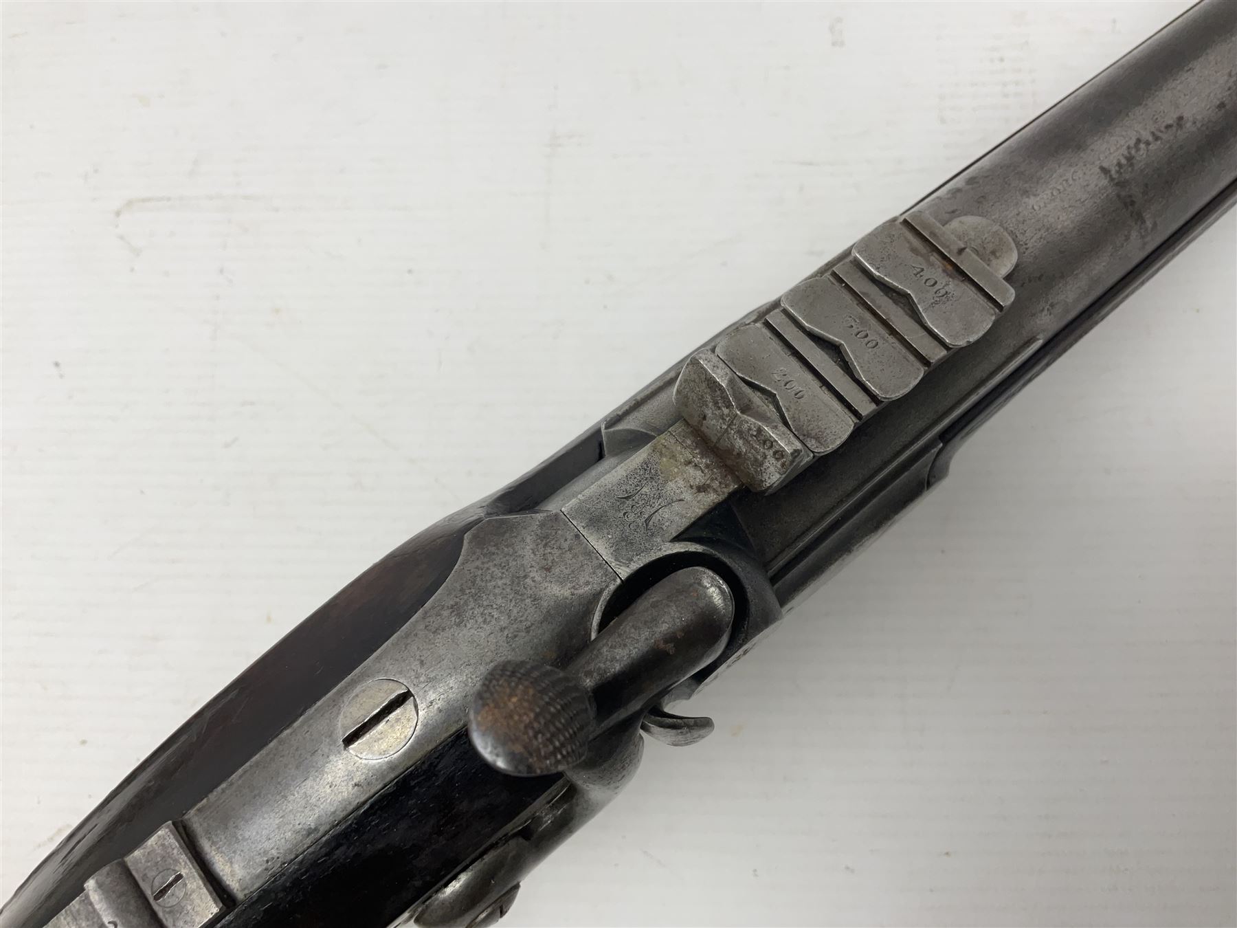 19th century George Gibbs of Bristol .461 cal. muzzle loading percussion match rifle with 28cm cut-down barrel and cut-down stock, Metford type rifling, fitted with additional three folding leaf rear sight to 400yds, back action sight still fitted to tang, maker's name to lock and top of barrel, serial no.439. L46.5cm overall