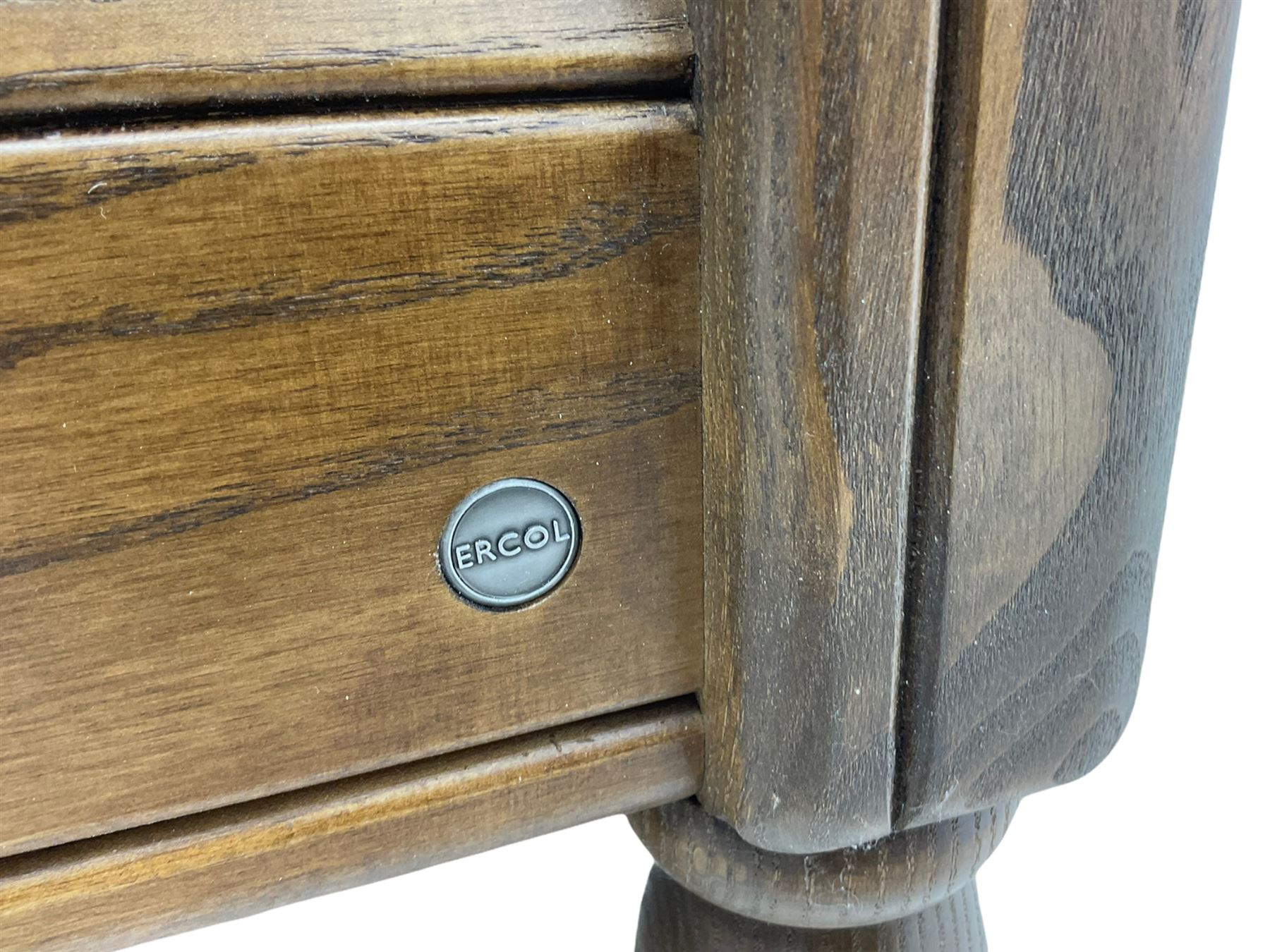 Ercol medium elm framed three seat bergere sofa, and pair of matching armchairs upholstered in red fabric