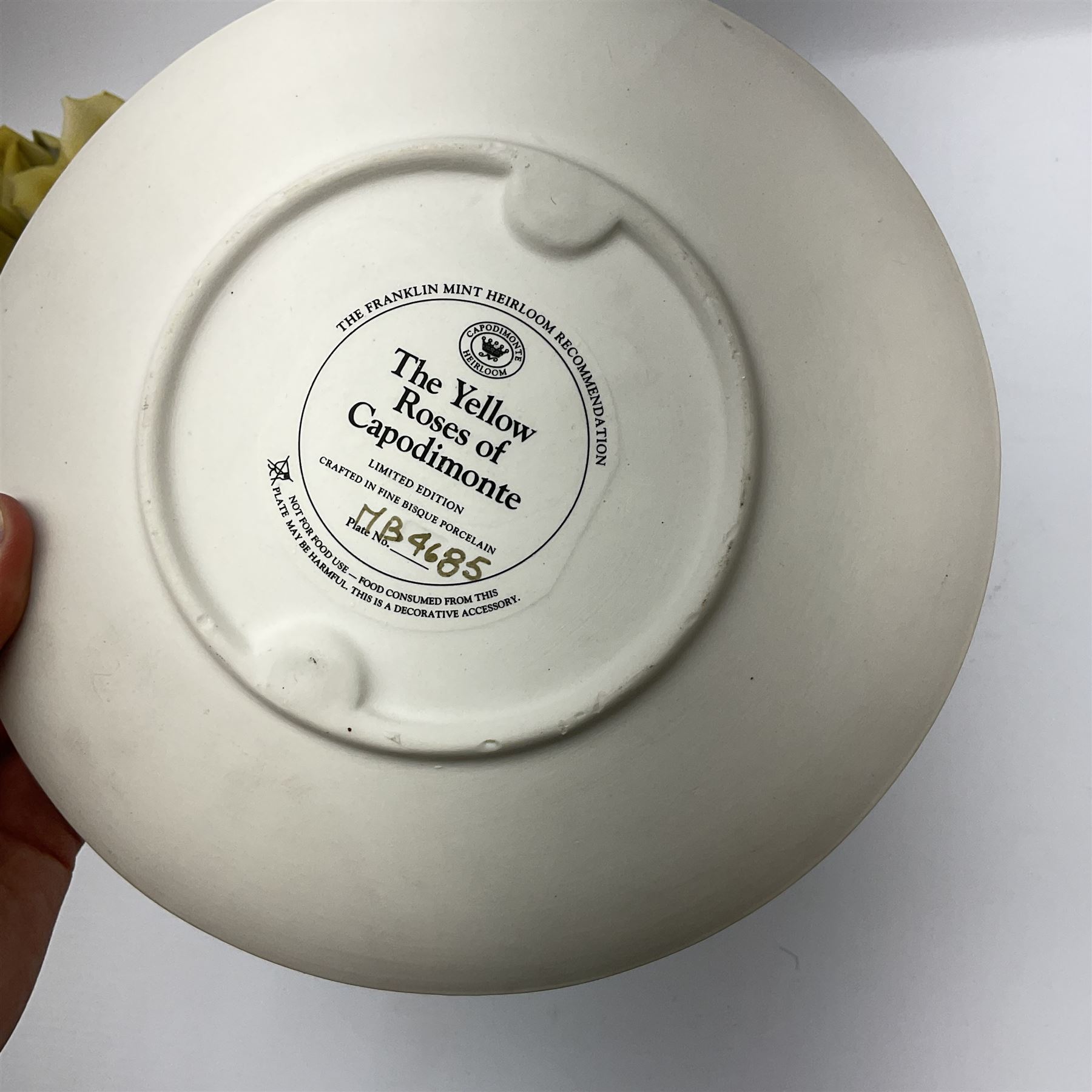 Franklin Mint The Yellow Roses of Capodimonte collectors plate, together with a Italian floral encrusted ornament modelled as a basket of yellow roses