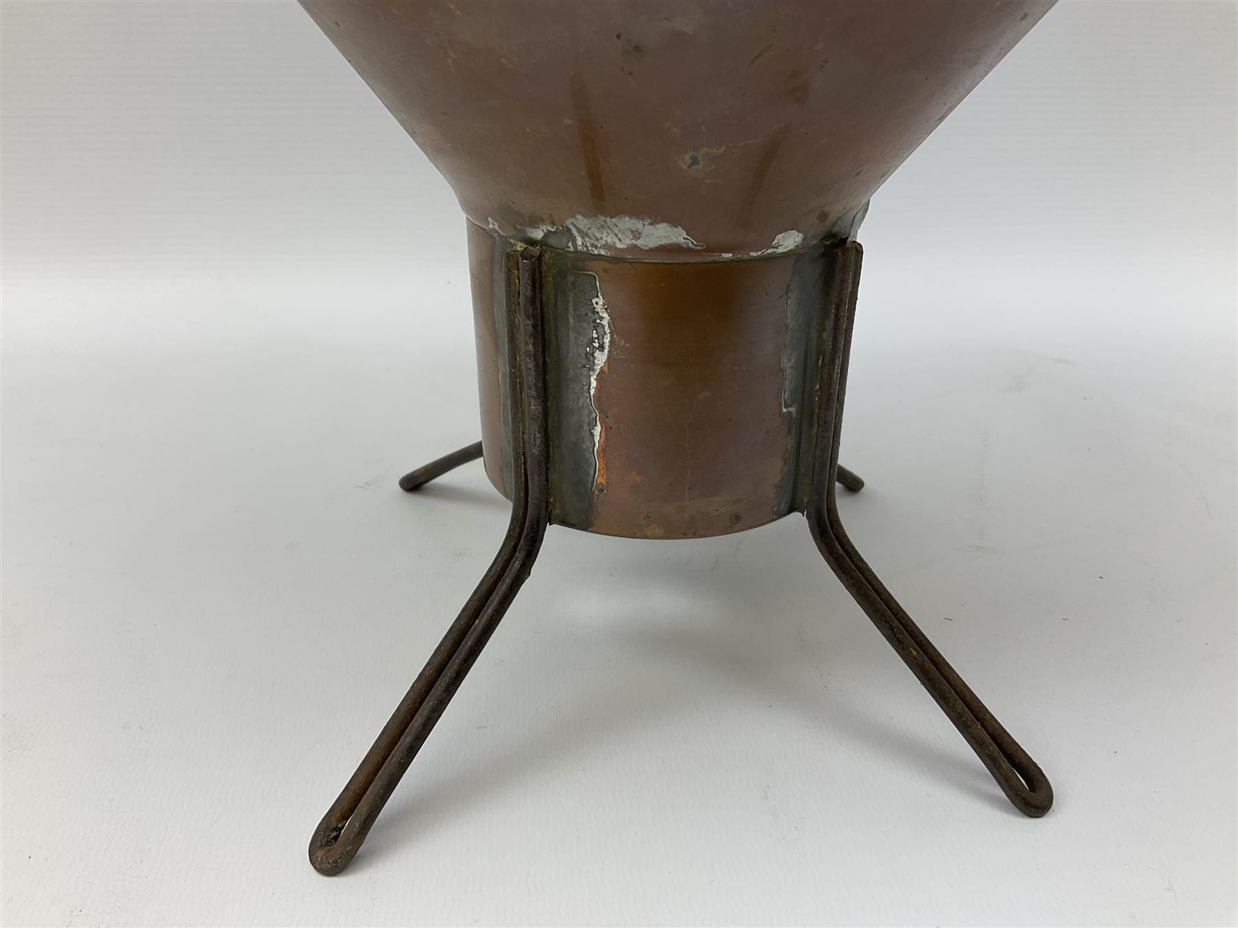 Agricultural copper corn funnel, H32.5cm, another similar copper funnel and copper warming platter of oval form, with twin handles on four supports, with removeable warming plate, L49cm