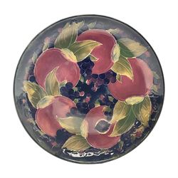 Moorcroft charger decorated in Pomegranate pattern, circa 1918, with painted and impressed marks beneath, D22cm