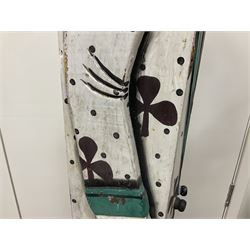 Folk art circus clown cabinet, the the two hinged doors with bow tie decoration opening to reveal fitted shelved interior, the body painted with polka dots and spades, H121cm