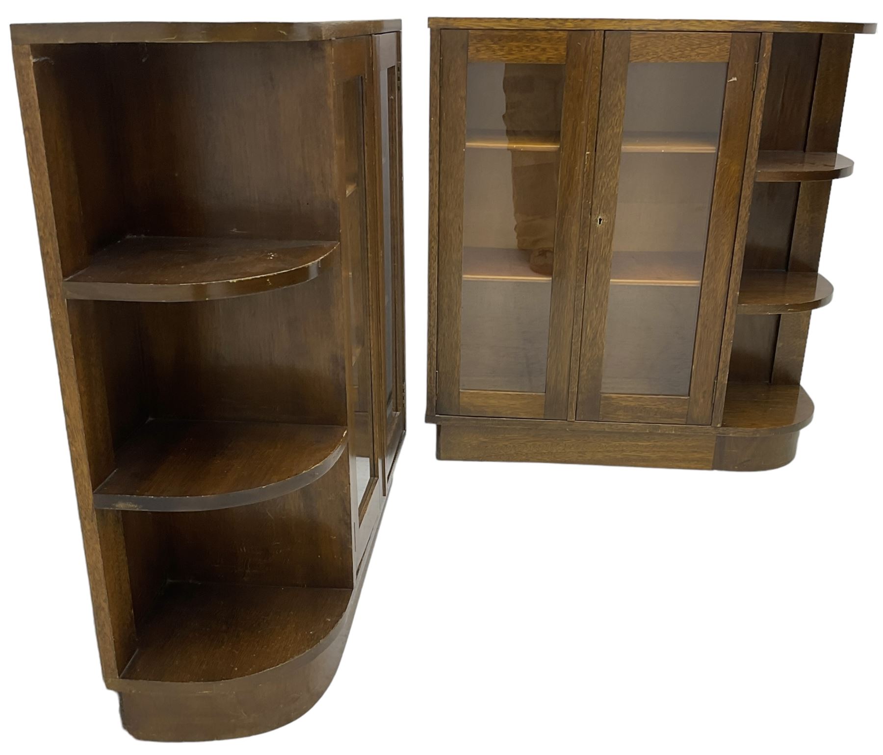 Pair of mid-20th century oak bookcases, rectangular form with curved ends, enclosed by glazed doors and fitted with shelves
