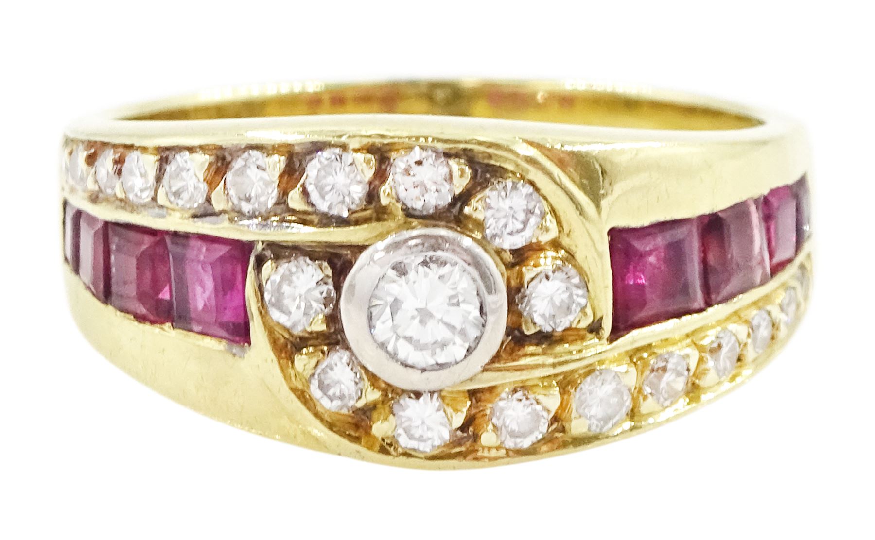 18ct gold diamond and ruby crossover ring, the principal round brilliant cut diamond of approx 0.10 carat, with graduating round brilliant cut diamond and calibre cut ruby shoulders, stamped 750